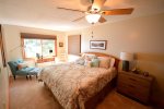 The master bedroom features a king size bed